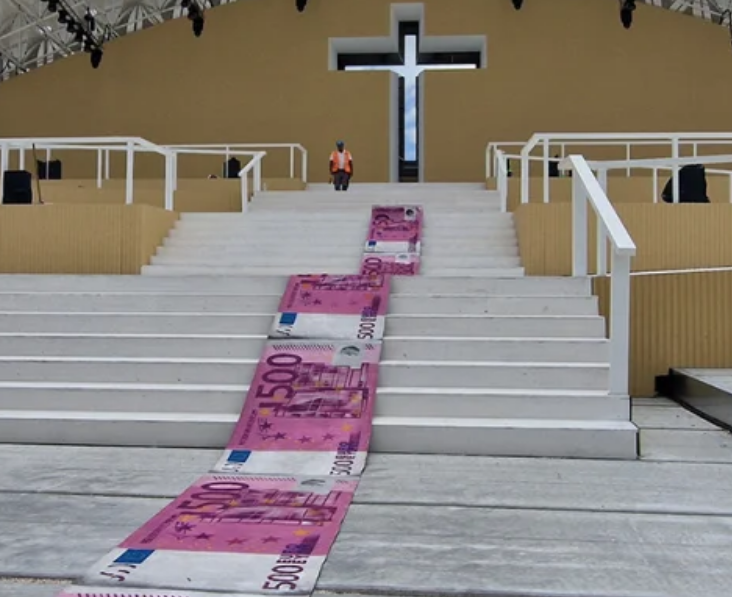 Portuguese street artist rolls out ‘banknote’ carpet to protest pope’s visit